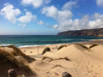 Scenic view of beach against sky
