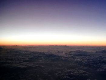 Scenic view of landscape against clear sky at sunset