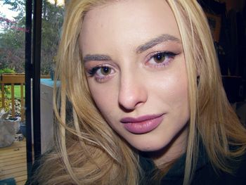 Close-up portrait of beautiful woman at home