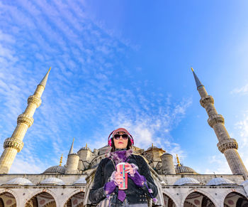 Low angle view of woman against hagia sophia museum