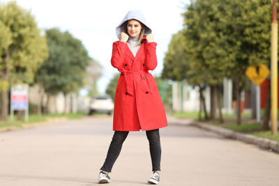 Portrait of young woman standing outdoors