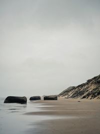 A lonely shore in jutland decorated by ruins of bunkers from the second world war