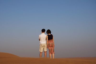 Silhouette of woman standing on landscape