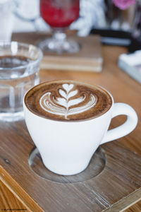 Close-up of coffee cup on table