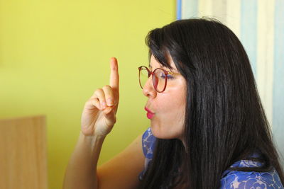 Close-up portrait of woman holding hands