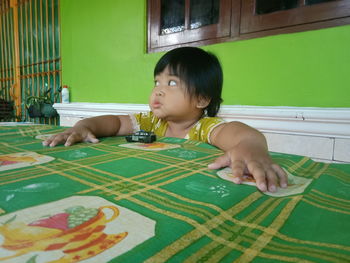 Portrait of girl looking at table