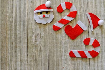 Directly above shot of christmas decorations on wooden table