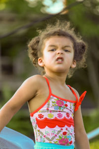 Portrait of cute girl standing outdoors