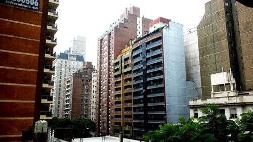 Low angle view of skyscrapers against sky