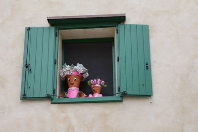 High angle view of woman standing against wall