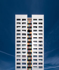 Low angle view of buildings against blue sky