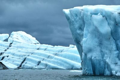 Scenic view of frozen sea against sky - iceland jökulsarlon icebergs 