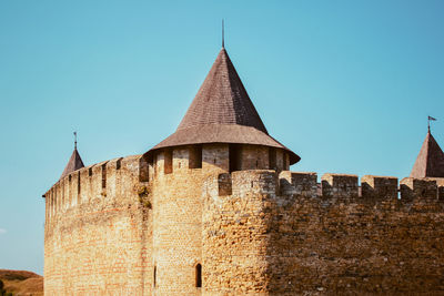 Low angle view of building against blue sky