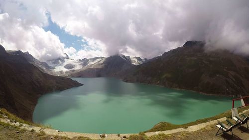 Scenic view of lake and mountains against sky