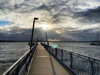 Pier over sea against sky