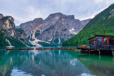 Scenic view of lake and mountains against sky