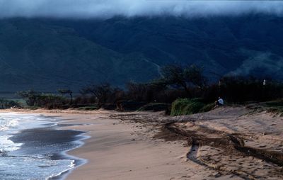 Scenic view of beach and mountain