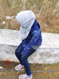 Side view of woman standing outdoors