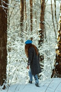  woman standing on snow covered land