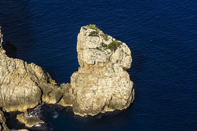 High angle view of rock formation in sea