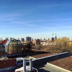 Cityscape against blue sky