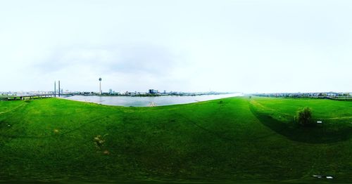 Scenic view of farm against sky