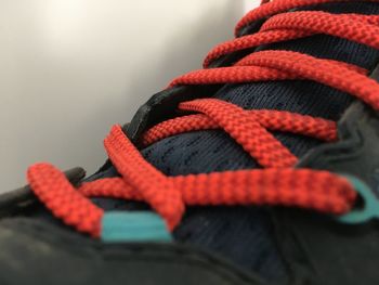 Close-up of rope tied to over white background