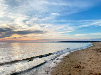 Scenic view of beach against sky during sunset