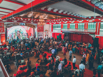 People at illuminated market stall