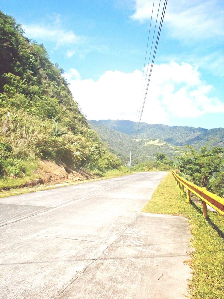 mountain, the way forward, sky, road, landscape, mountain range, tranquil scene, tranquility, transportation, diminishing perspective, electricity pylon, scenics, cloud, cloud - sky, vanishing point, country road, power line, nature, connection, long