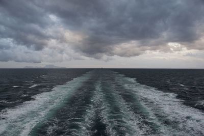 View of calm sea against cloudy sky