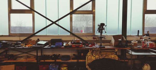 People standing by window at home