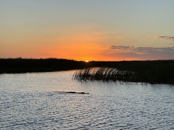 Scenic view of sea against sky during sunset