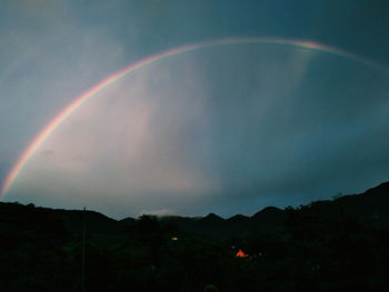 Scenic view of rainbow against sky during sunset