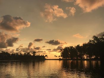 Scenic view of lake against sky during sunset 