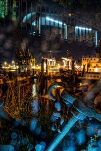 Illuminated street lights in city at night