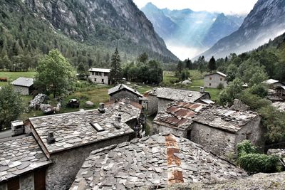 High angle view of houses and mountains against sky