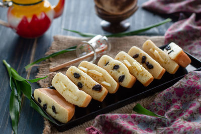 High angle view of pukis, indonesian street food, a fluffy yeasty sweet snack in a plate on a table