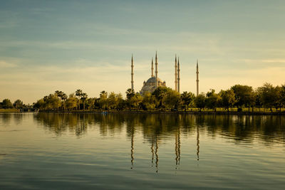 View of mosque against cloudy sky