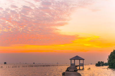 Scenic view of beach against sky during sunset