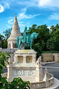 Statue of historic building against sky