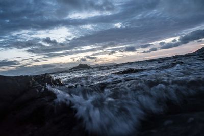 Scenic view of sea against sky at sunset