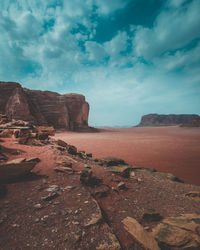 Rock formations on landscape against sky