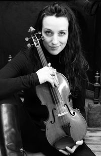 Portrait of young woman with violin