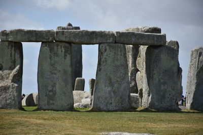 Built structure on field against sky