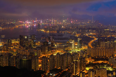 High angle view of illuminated city buildings at night