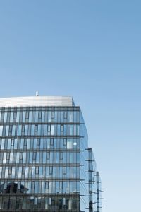 Low angle view of buildings against clear blue sky