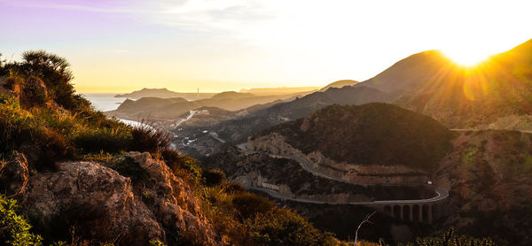 Scenic view of mountains against sky during sunset