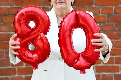 Close-up of person standing with umbrella