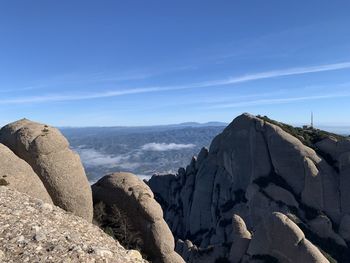 Panoramic view of rock formations against sky